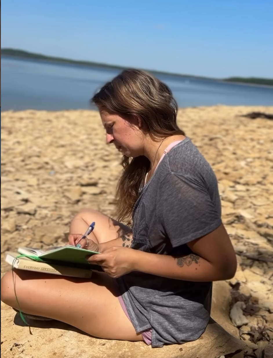 Amanda journaling on the beach — UGC and brand collaborations